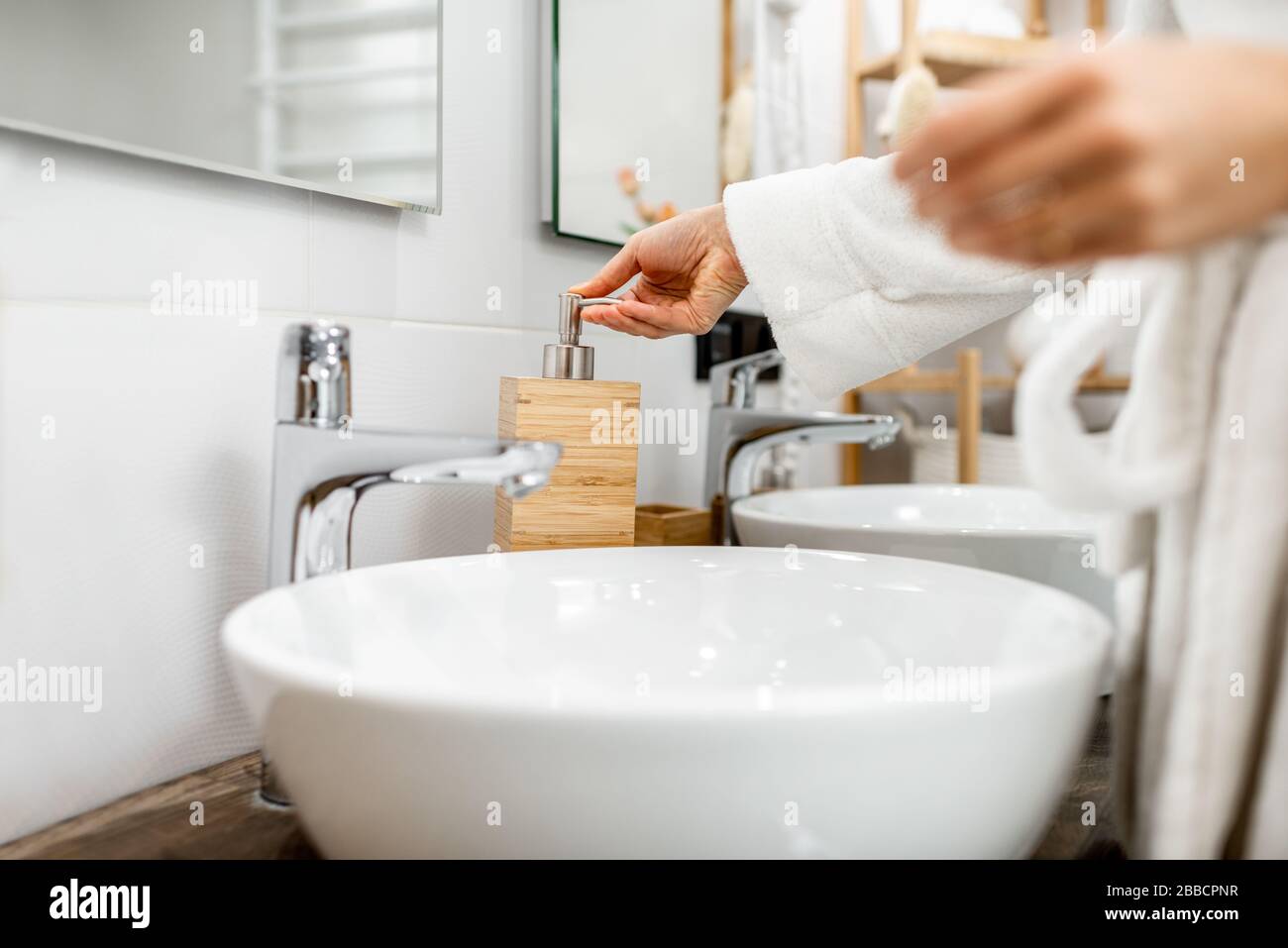 Woman applying make up washroom hi-res stock photography and images - Alamy