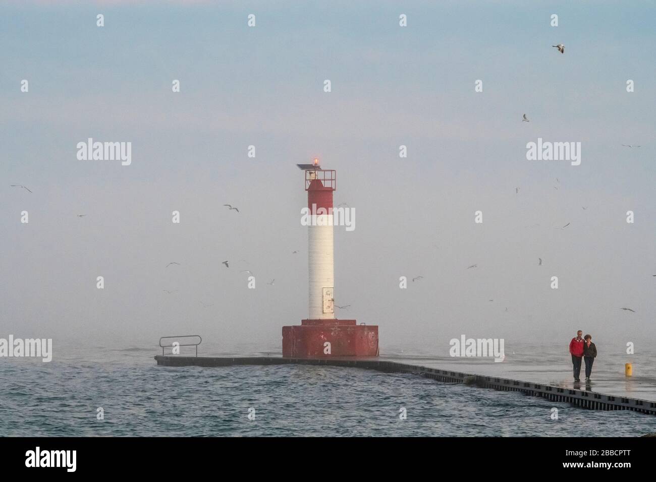 Lighthouse on lake Ontario in foggy weather Stock Photo