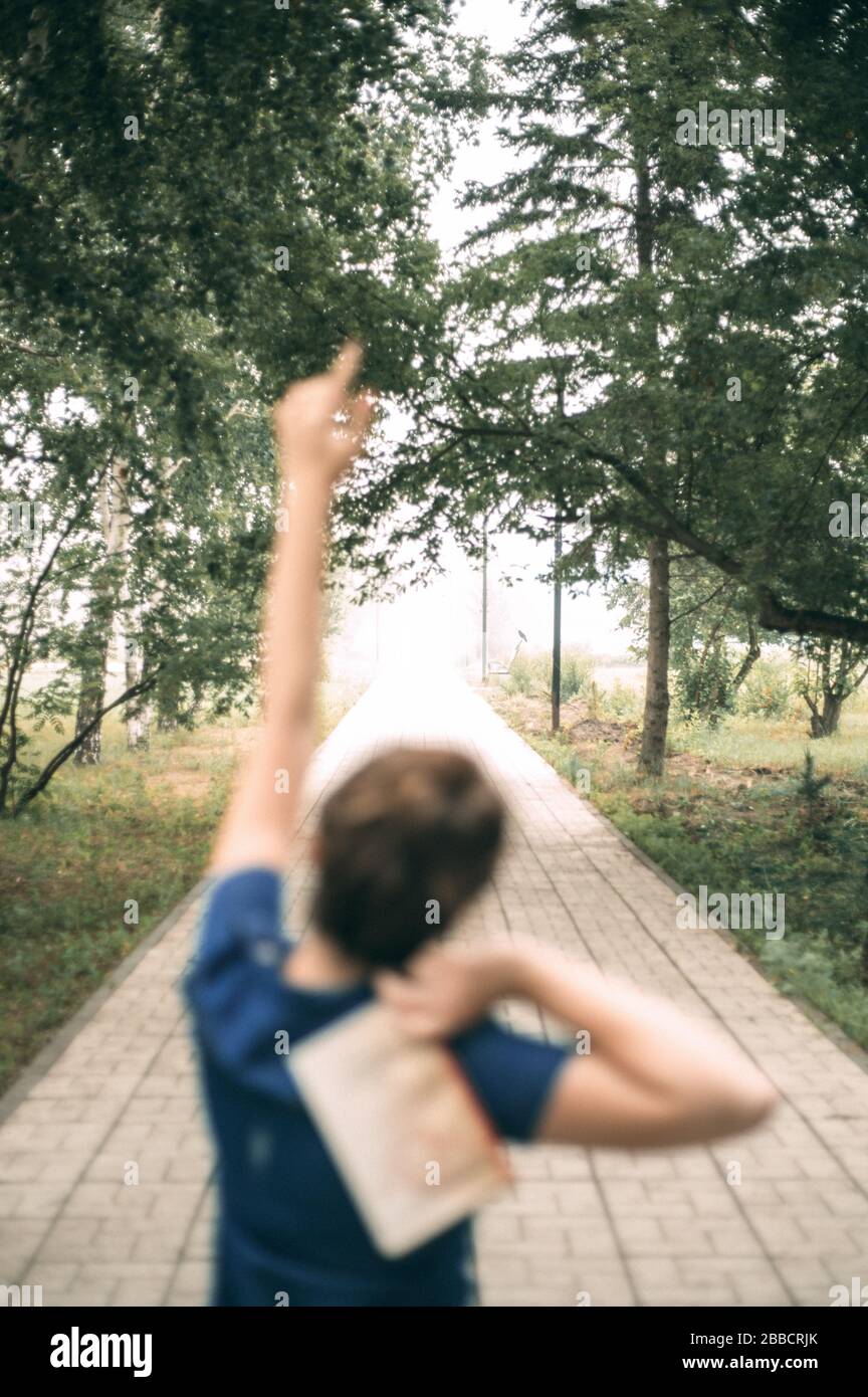A girl in the Park with a book Stock Photo - Alamy