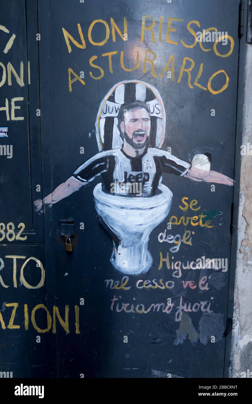 A plumber shop in Naples, Italy, advertising his services using a joke reference to Juventus and Gonzalo Higuain Stock Photo