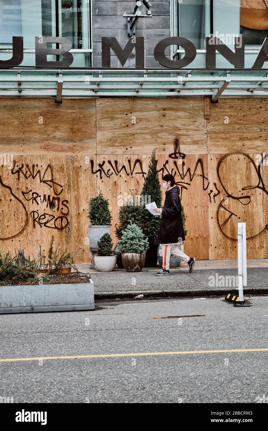 VANCOUVER, BC, CANADA MAR 30, 2020: Retail shops in Vancouver streets are barricading their storefront amid the coronavirus spreads crisis. Stock Photo