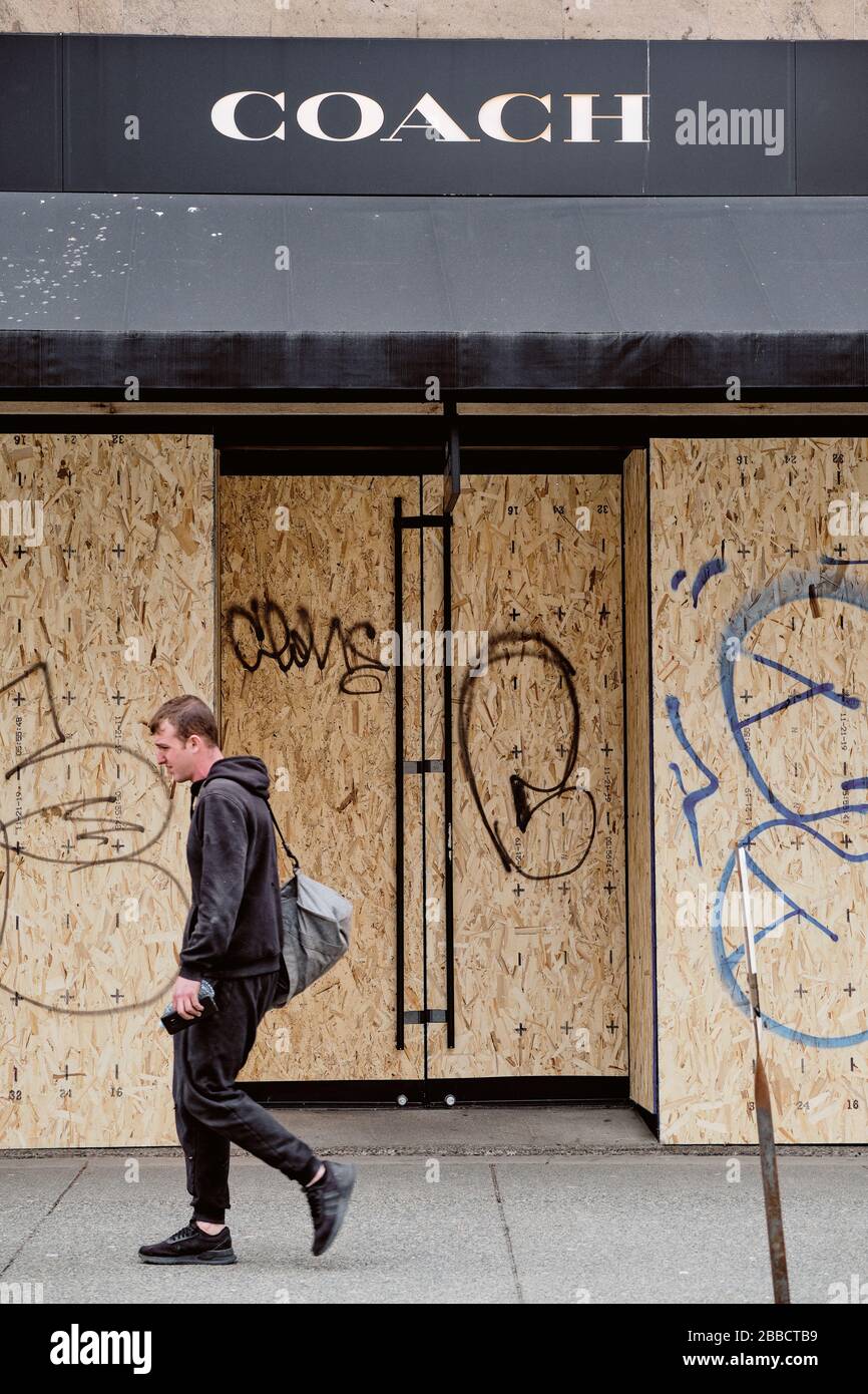 VANCOUVER, BC, CANADA MAR 30, 2020: Retail shops in Vancouver streets are barricading their storefront amid the coronavirus spreads crisis. Stock Photo