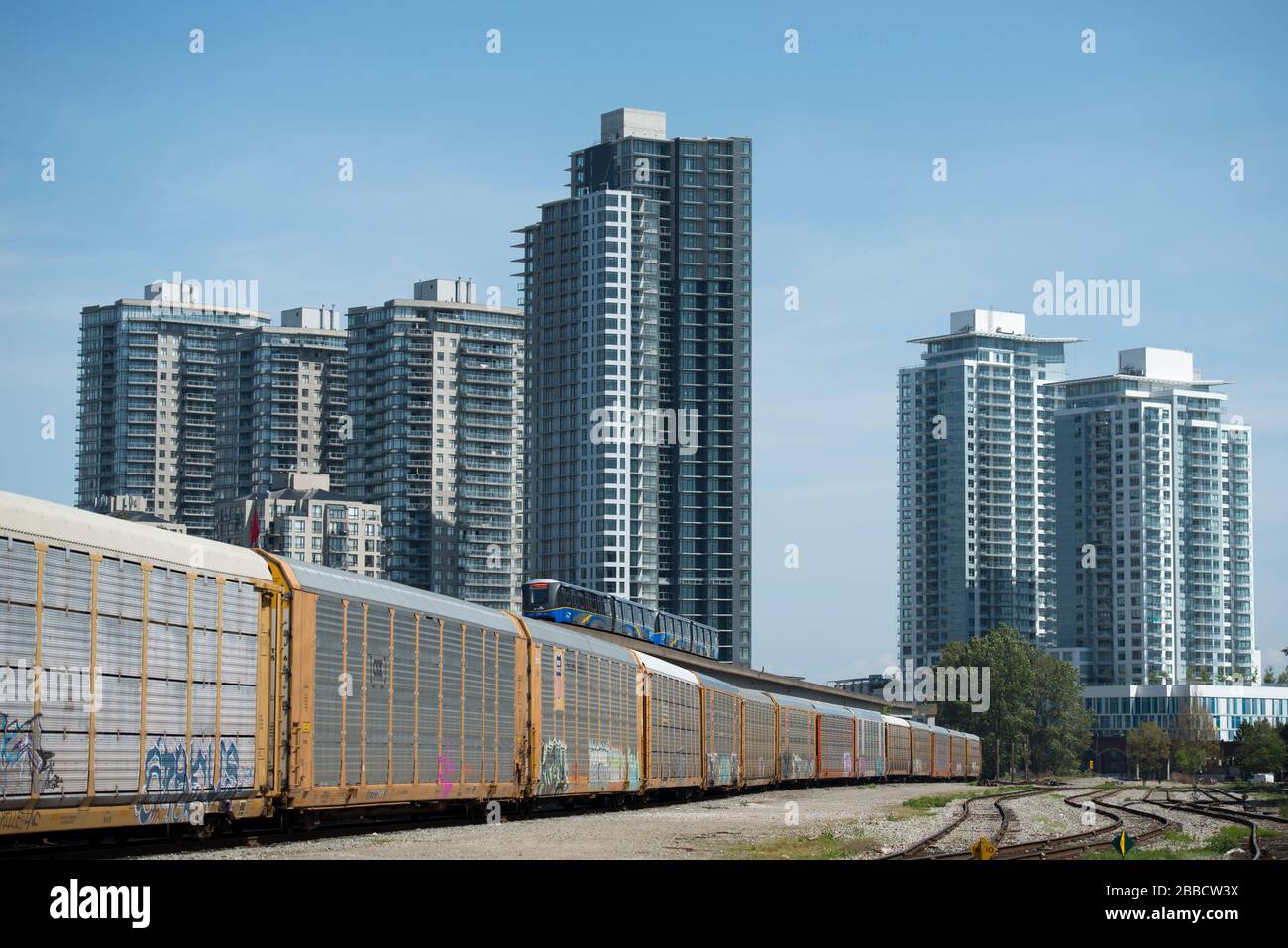 Rail yard, Skytrain and condominiums in New Westminster, British Columbia, Canada. Stock Photo