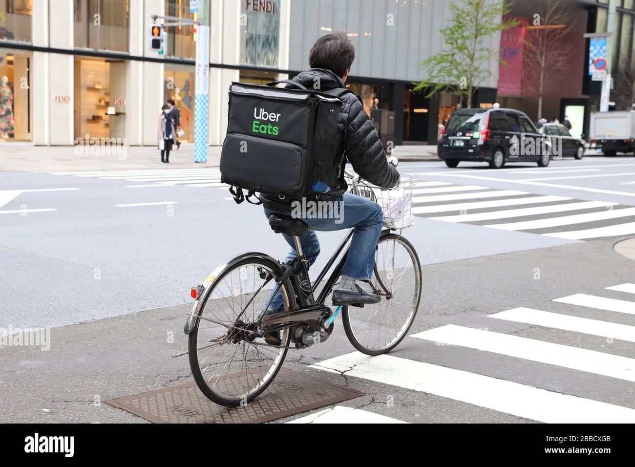 An Uber Eats food delivery courier is seen at Ginza shopping 