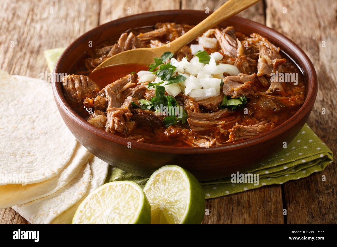 Mexican dish of Birria de Res from slowly stewed beef close-up in a bowl on the table. horizontal Stock Photo