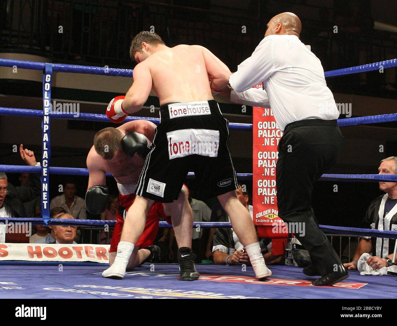 George Hillyard (Canning Town, black shorts) defeats Danny Goode (New Milton, red shorts) in a Light-Middleweight contest at York Hall Bethnal Green, Stock Photo