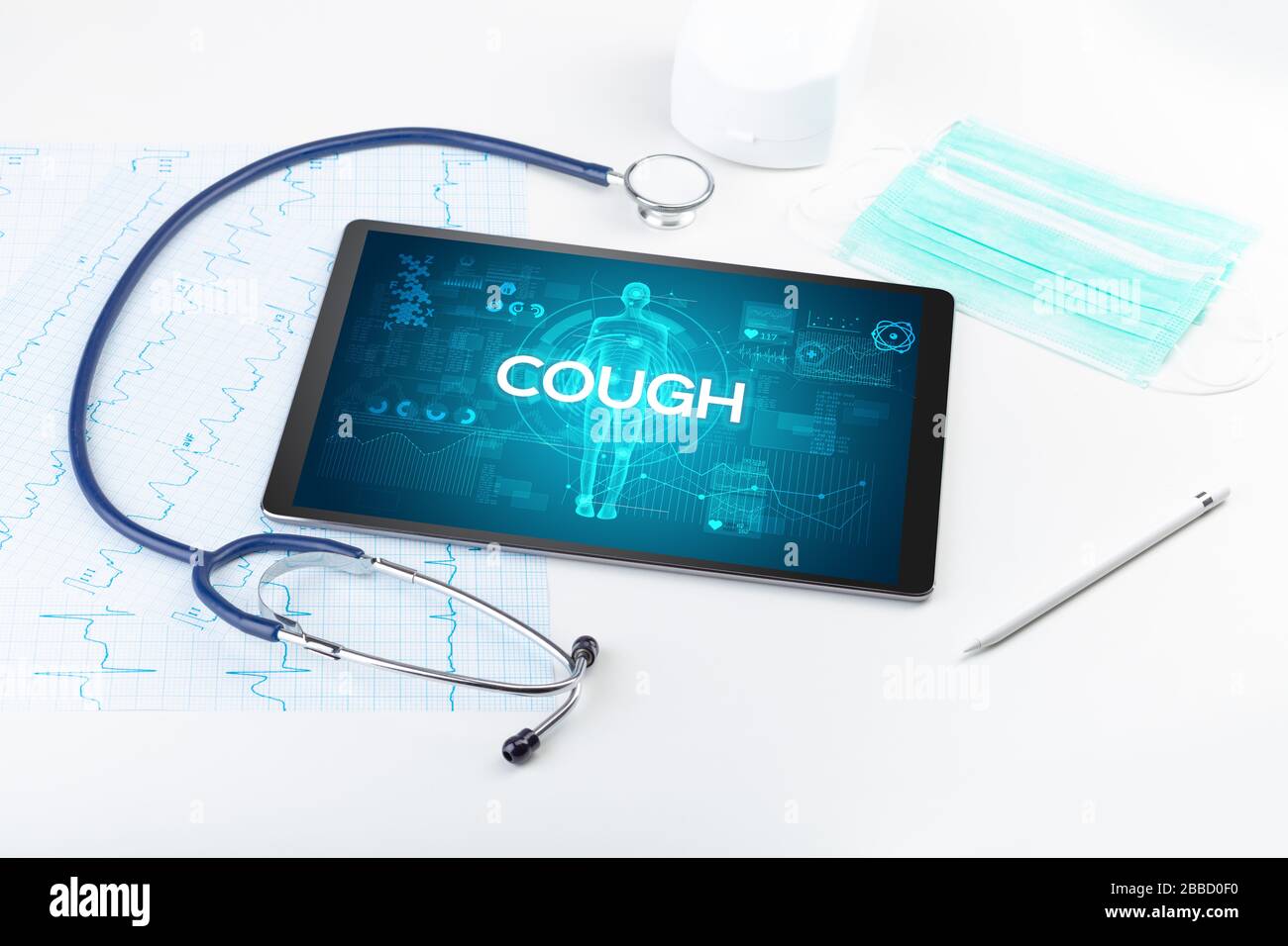 Tablet pc and doctor tools with COUGH inscription, coronavirus concept Stock Photo