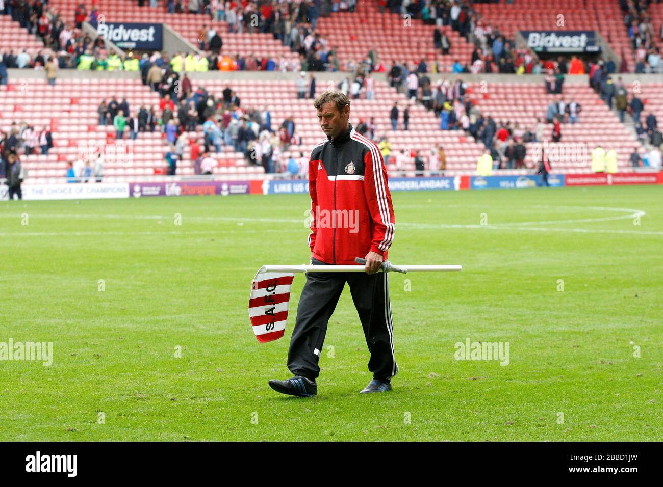 Sunderland ground staff remove the corner flags at the final whistle