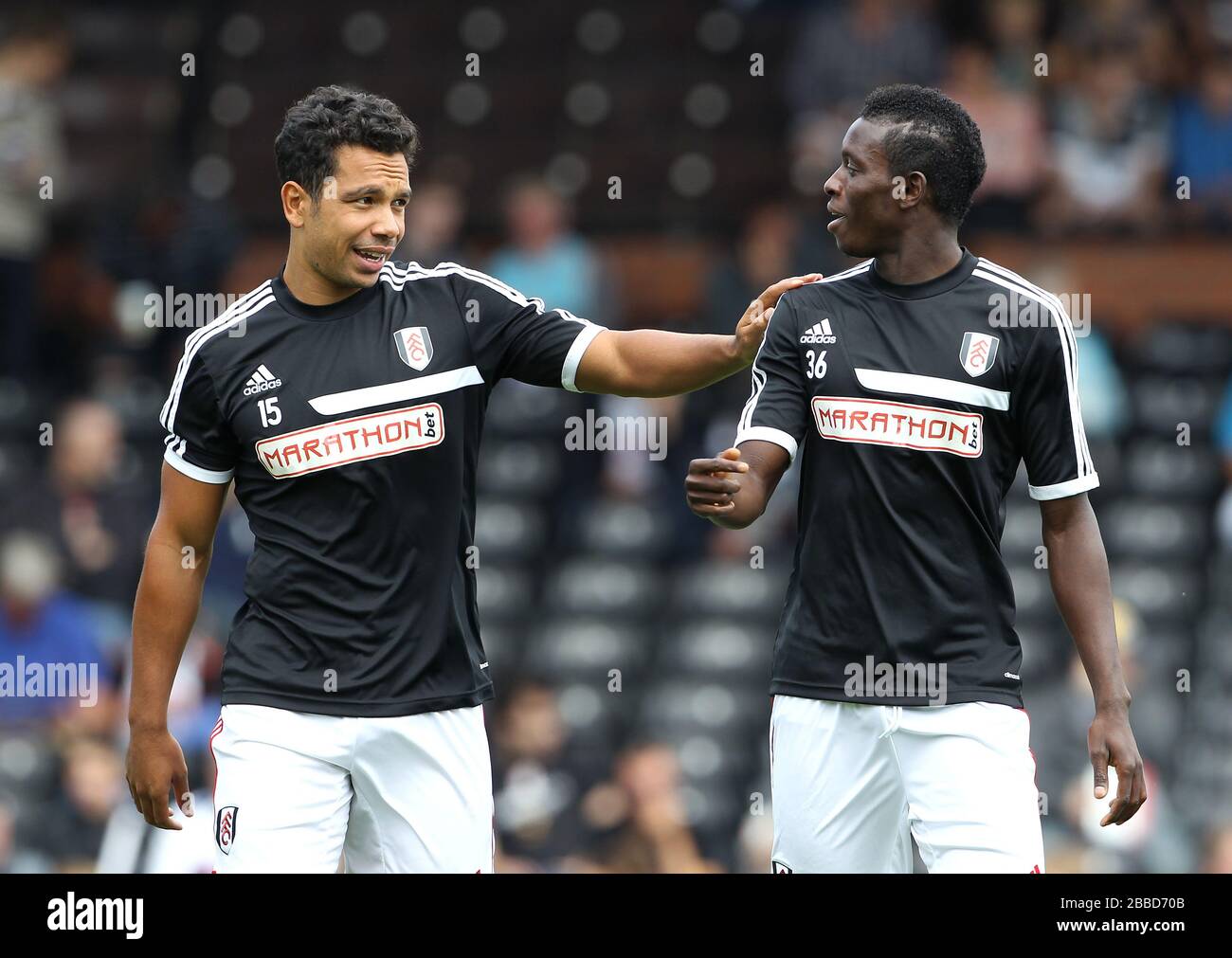 Fulham's Buomesca Tue Na Bangna (right) and teammate Kieran Richardson