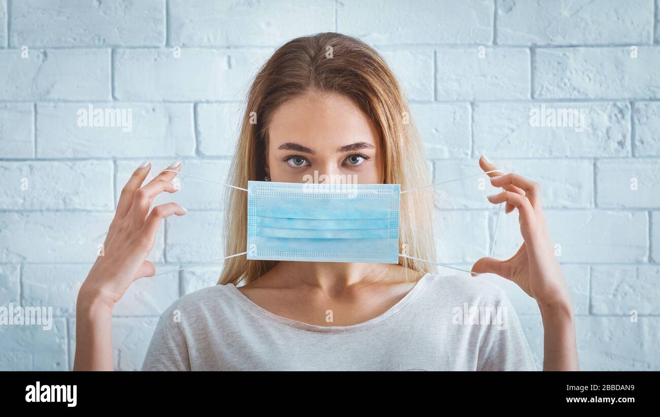Girl puts mask hi-res stock photography and images - Alamy