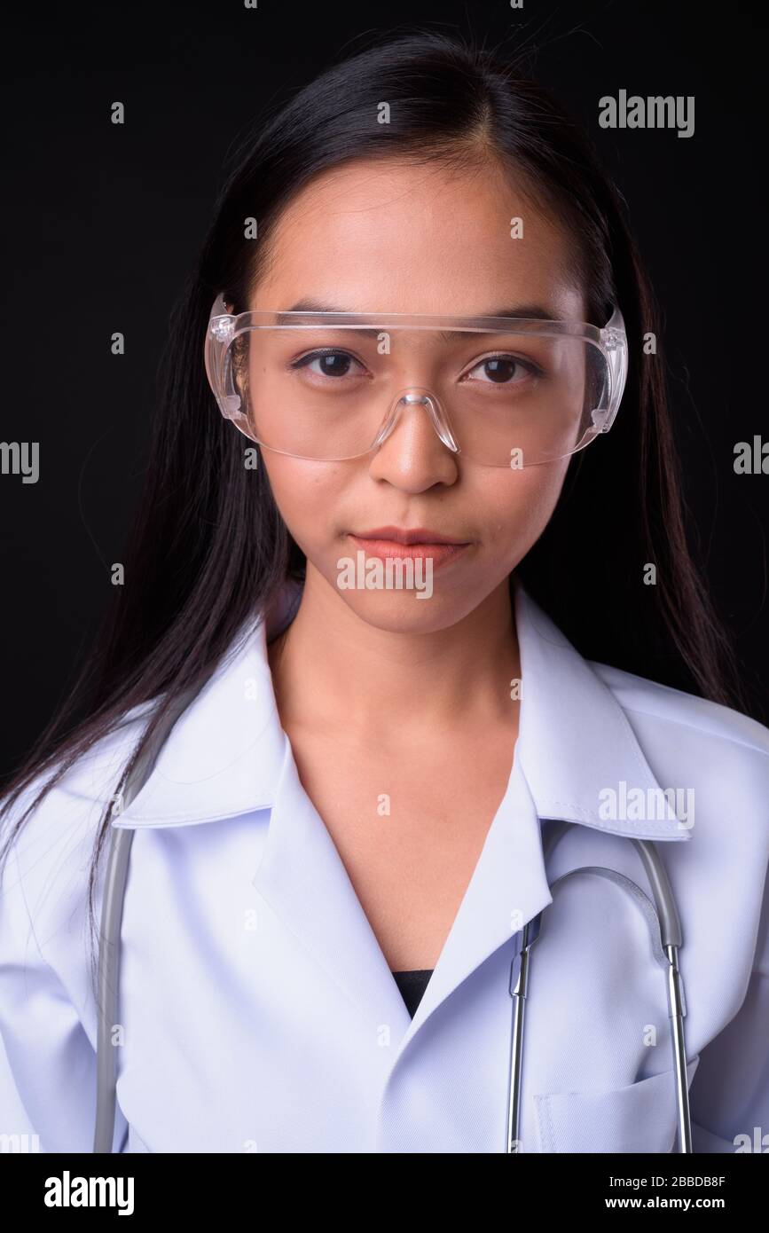 Face of young beautiful Asian woman doctor as scientist Stock Photo - Alamy