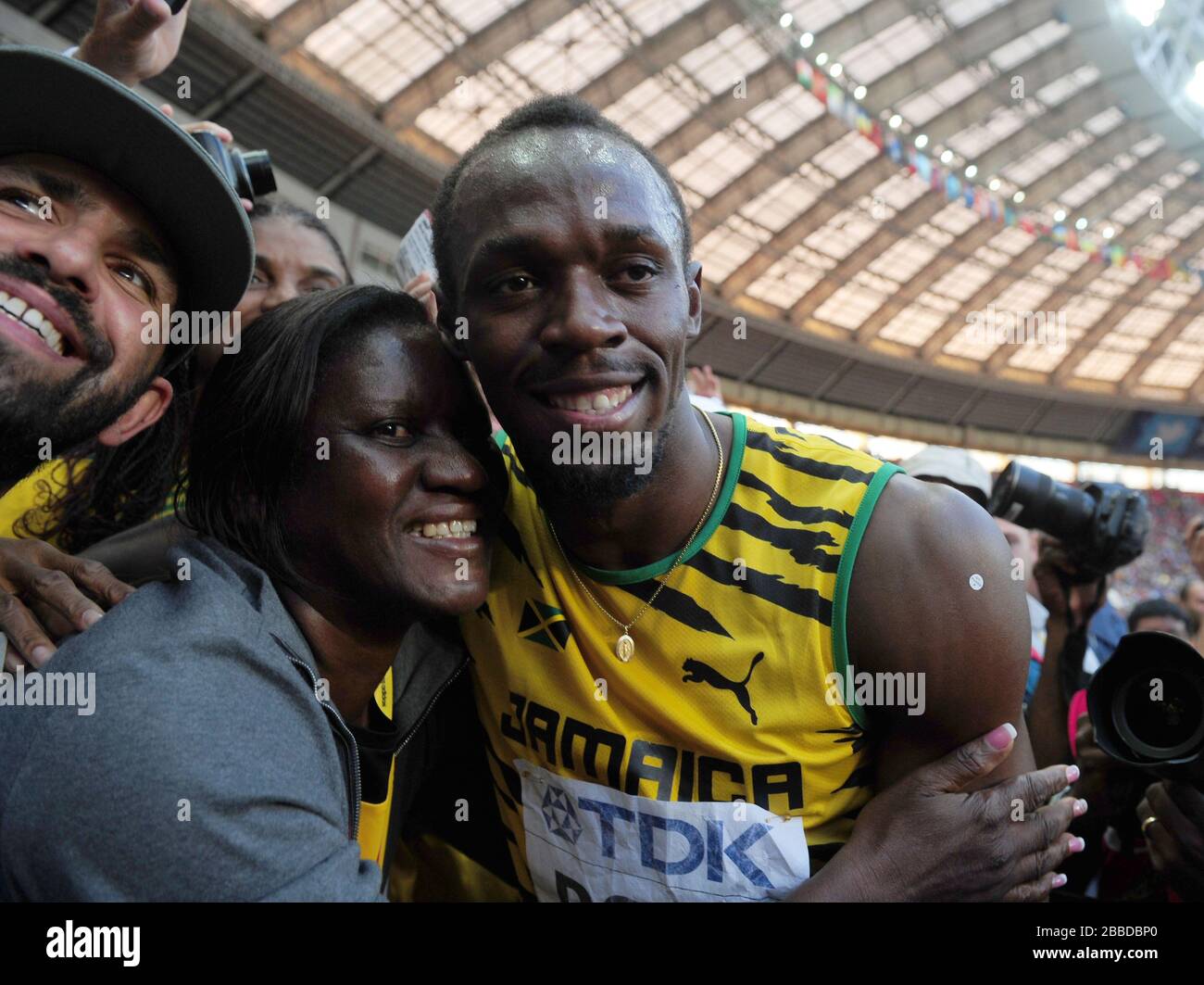 Winner of the Men's 200m Final, Jamaica's Usain Bolt gets a hug from