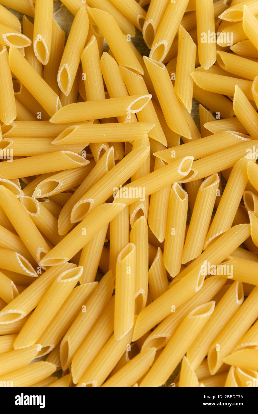 food-background-dry-penne-pasta-whole-wheat-uncooked-ingredient