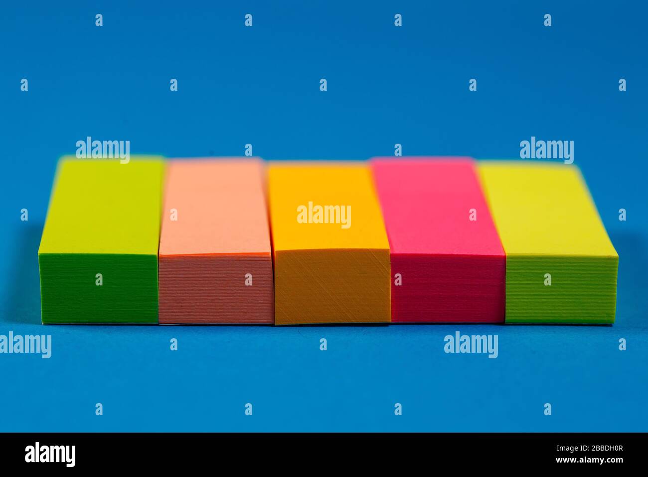 color stickers for notes on a colored background Stock Photo Alamy