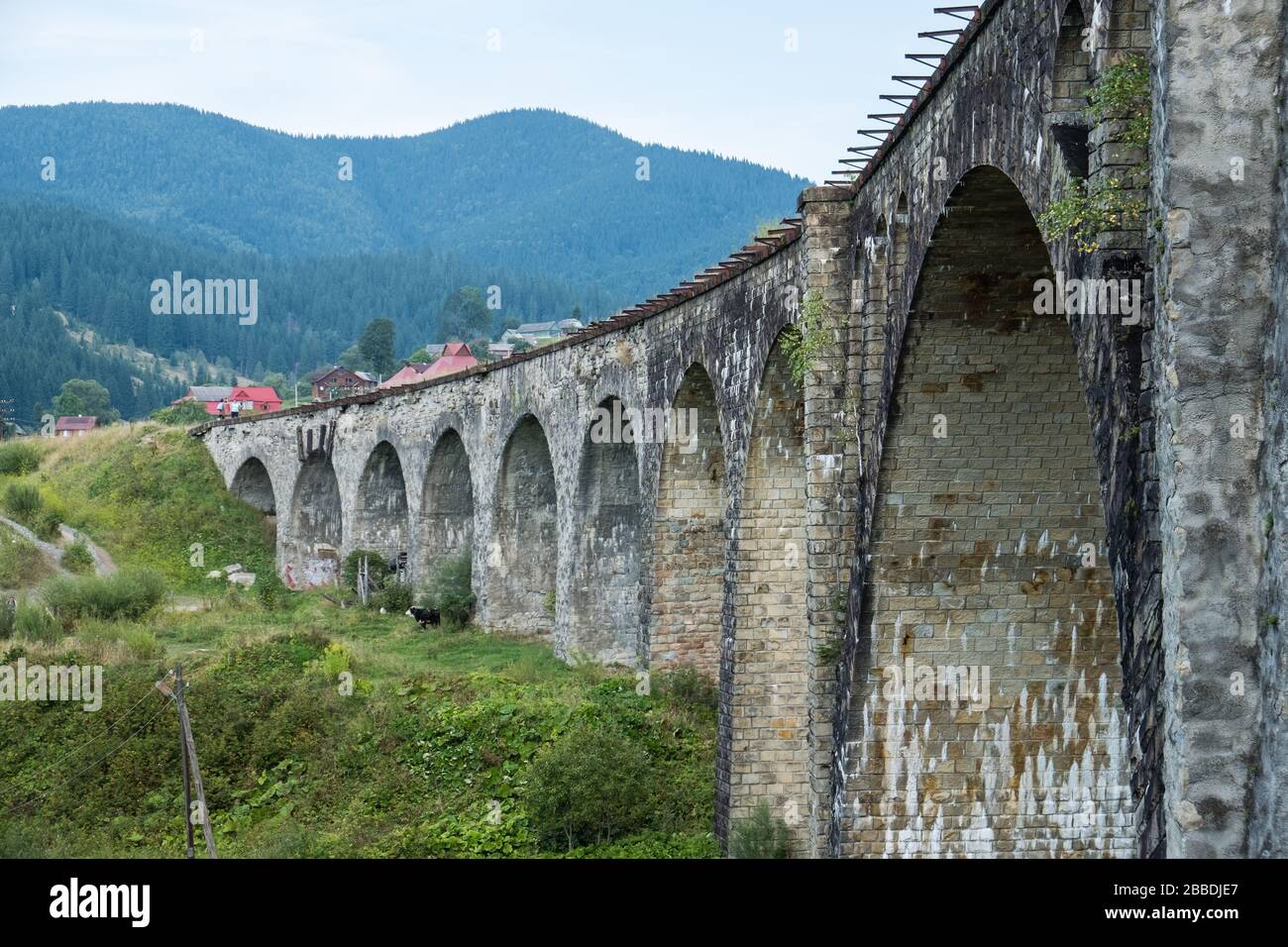 old viaduct railway crossing in Vorokhta village, Ukraine Carpathians. River Prut and bridges Stock Photo