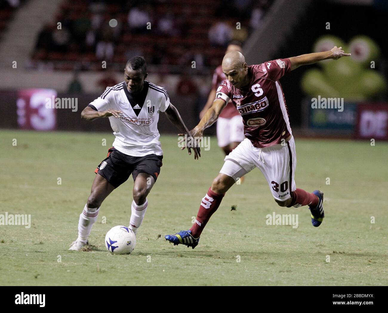 Fulham's Buomesca Tue Na Bangna (left) and Gabriel Badilla in action