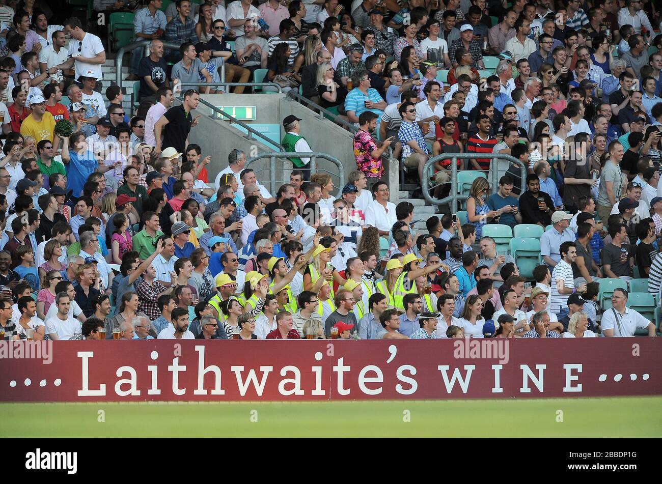 The crowd enjoy the action from the stands at the Kia Oval Stock Photo ...