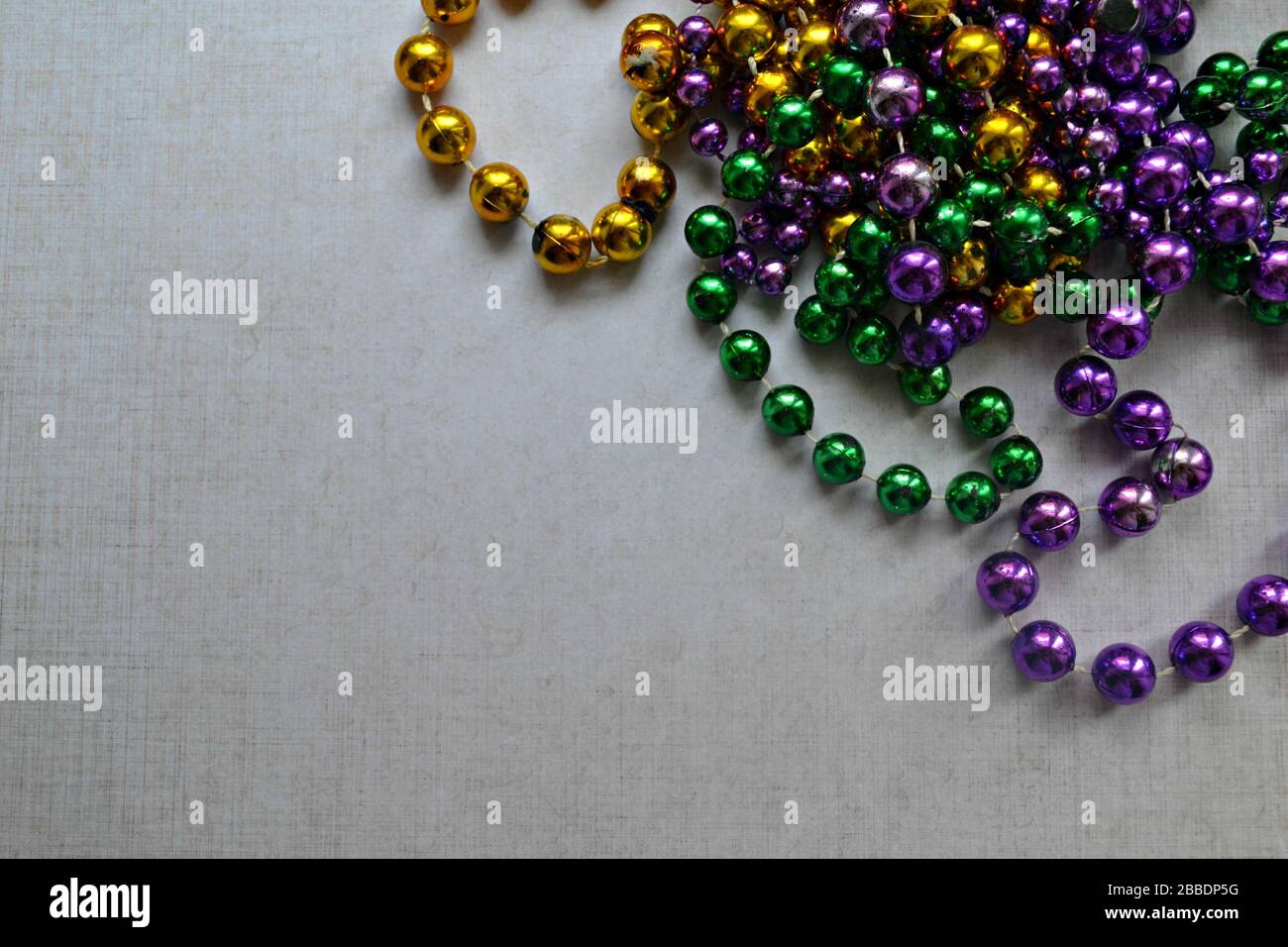 Mardi Gras traditional colorful beads from New Orleans, Luisiana, US Stock Photo
