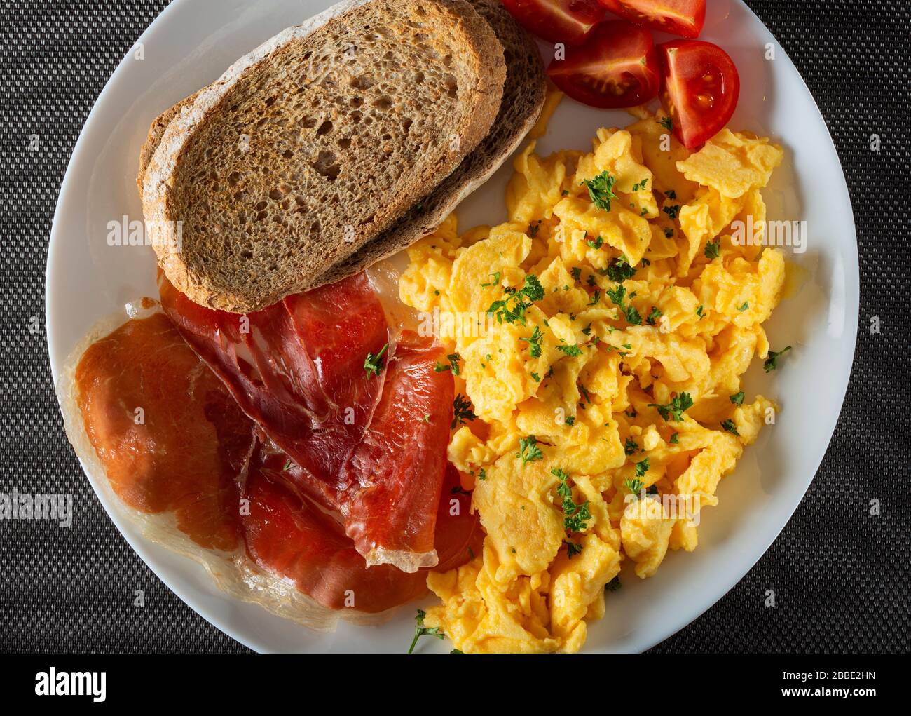 Fresh omelette with ham and toast - top view Stock Photo