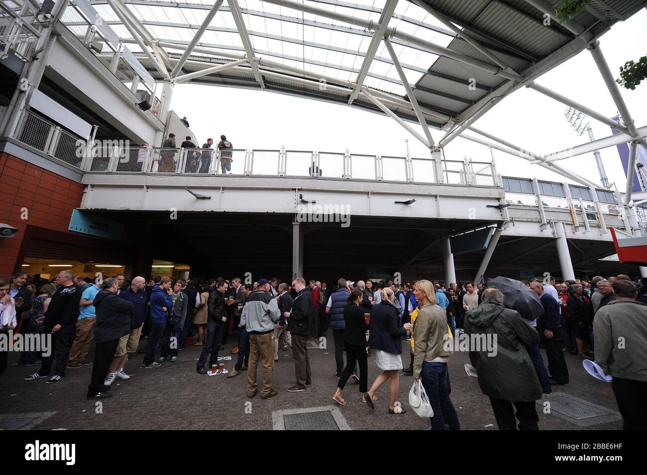 General view of spectators milling around outside the stadium Stock ...