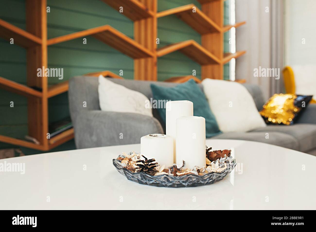 white candles in a candlestick for aromatherapy against the background