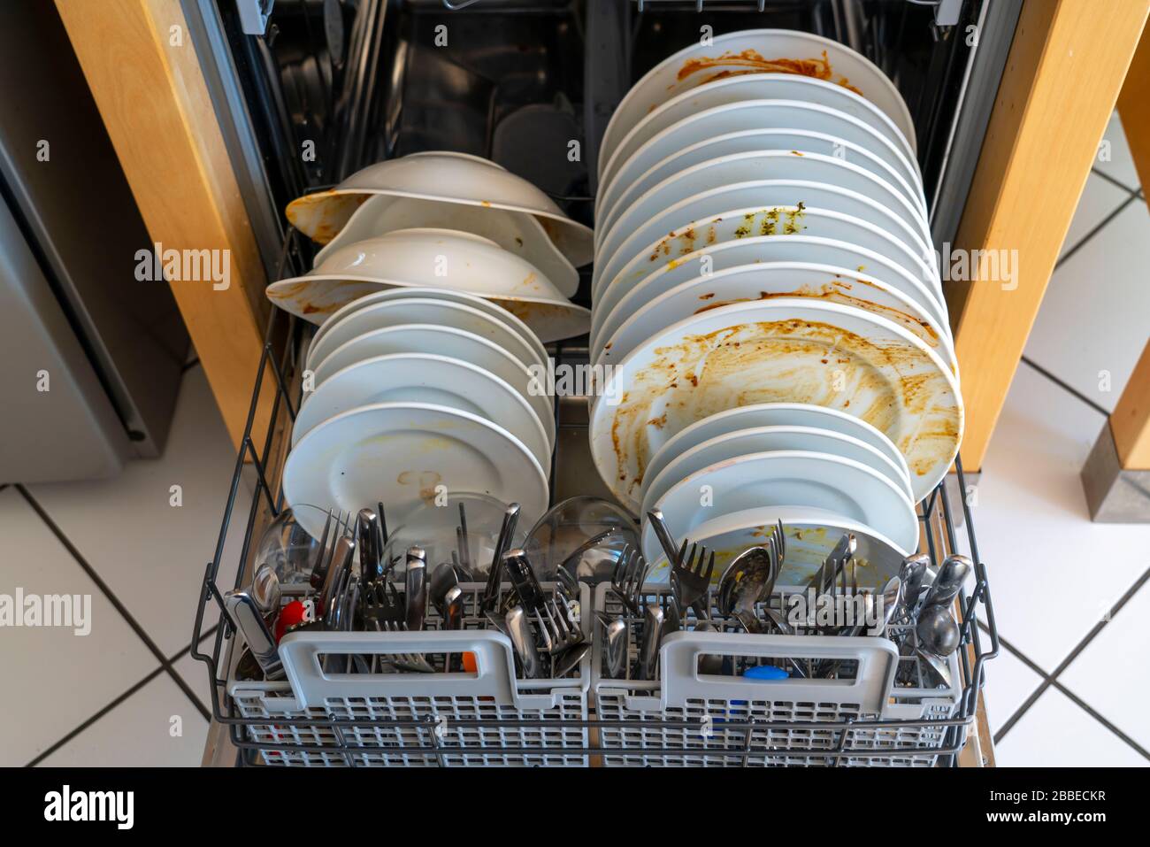 Dishwasher, full of dirty dishes Stock Photo Alamy