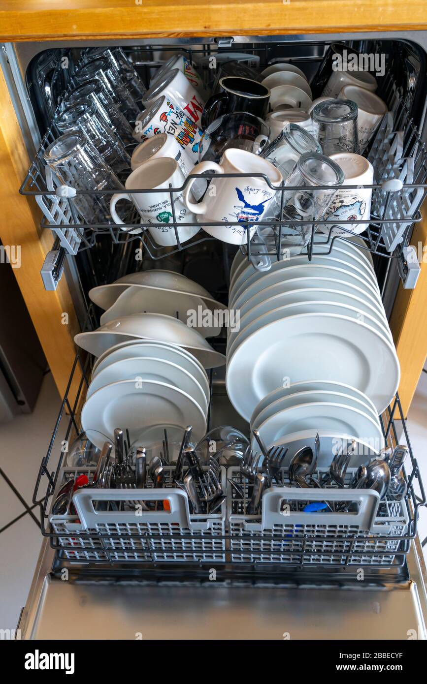 Dishwasher, full of clean dishes Stock Photo Alamy
