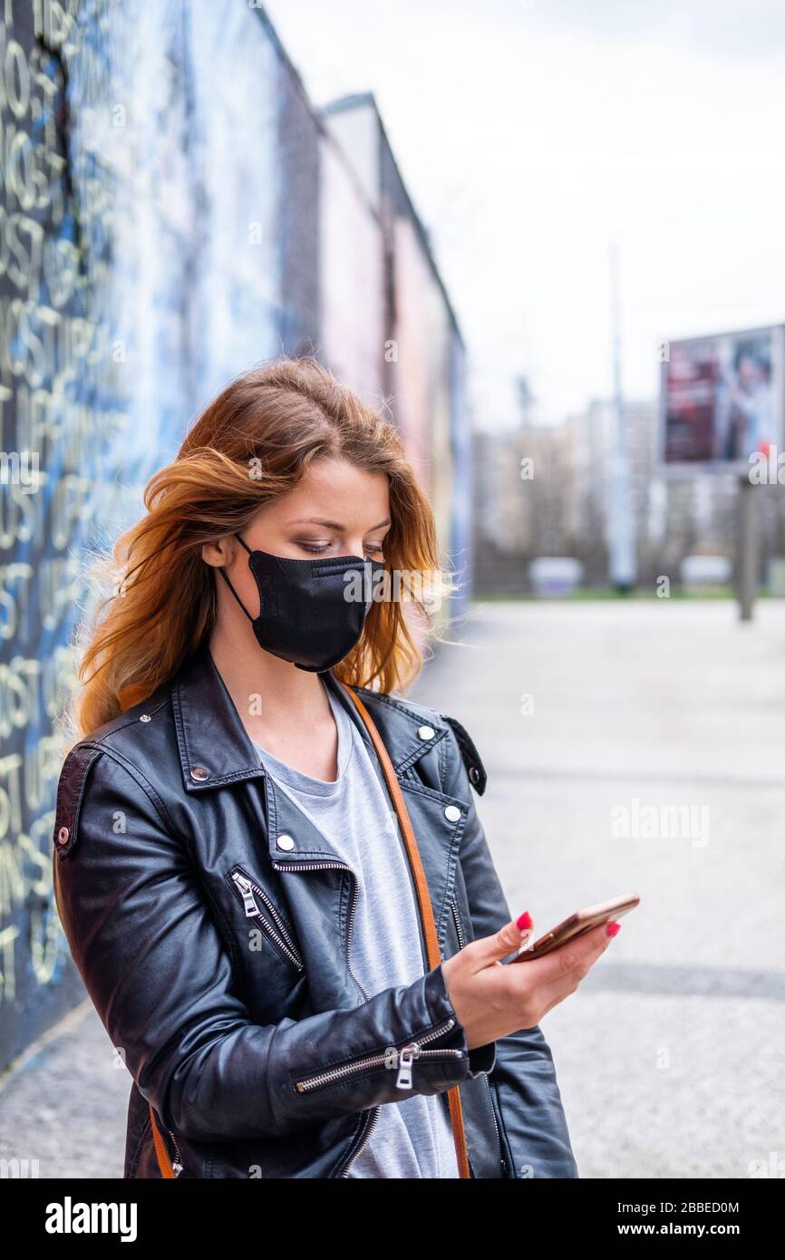 European woman travel wearing face protection agains coronavirus Stock Photo