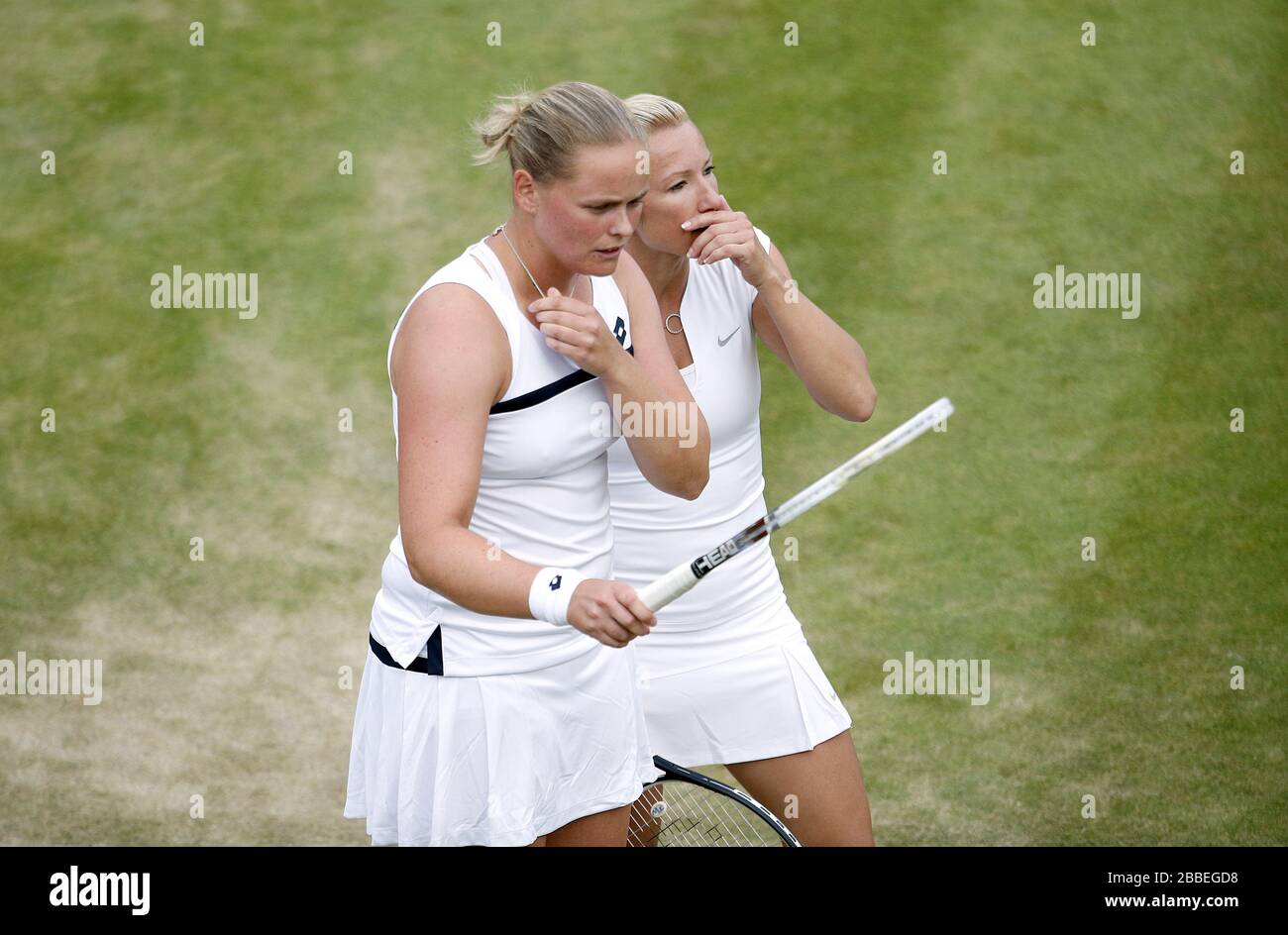 Germany's Anna-Lena Groenefeld (left) and Czech Republic's Kveta Peschke react in their women's doubles match against Great Britain's Laura Robson and USA's Lisa Raymond during day six of the Wimbledon Championships at The All England Lawn Tennis and Croquet Club, Wimbledon. Stock Photo