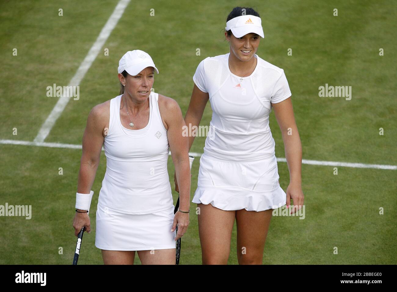 Great Britain's Laura Robson (right) and USA's Lisa Raymond in their women's doubles match against Germany's Anna-Lena Groenefeld and Czech Republic's Kveta Peschke during day six of the Wimbledon Championships at The All England Lawn Tennis and Croquet Club, Wimbledon. Stock Photo