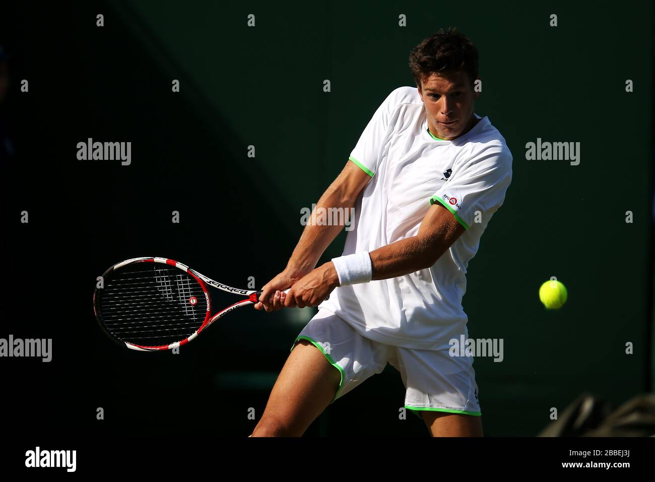 Italy's Gianluigi Quinzi in action against Great Britain's Samm Butler in  the Boy's Single's during day six of the Wimbledon Championships at The All  England Lawn Tennis and Croquet Club, Wimbledon Stock