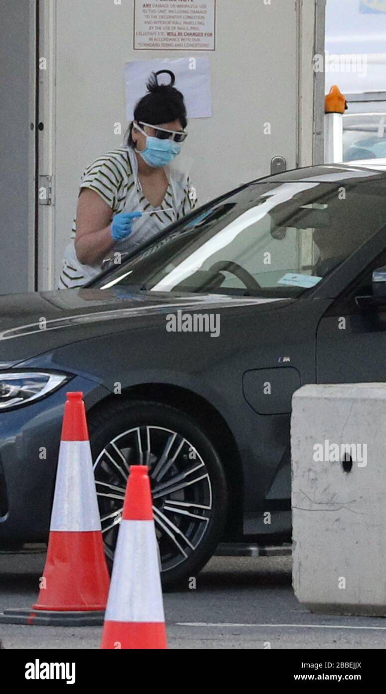 A person holds a swab at a Covid19 drivethrough test centre for NHS
