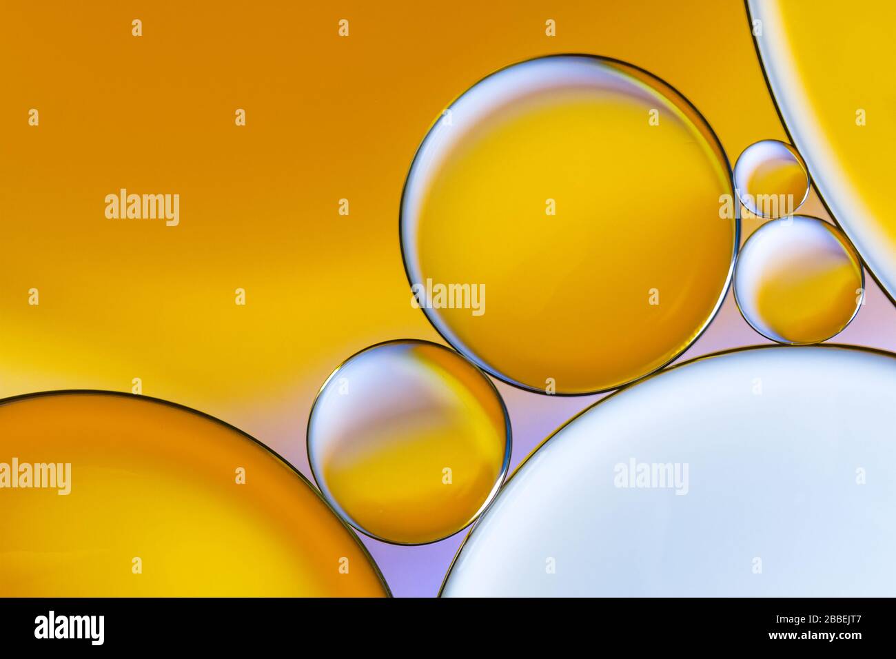 Colourful close up of oil drops floating on water Stock Photo