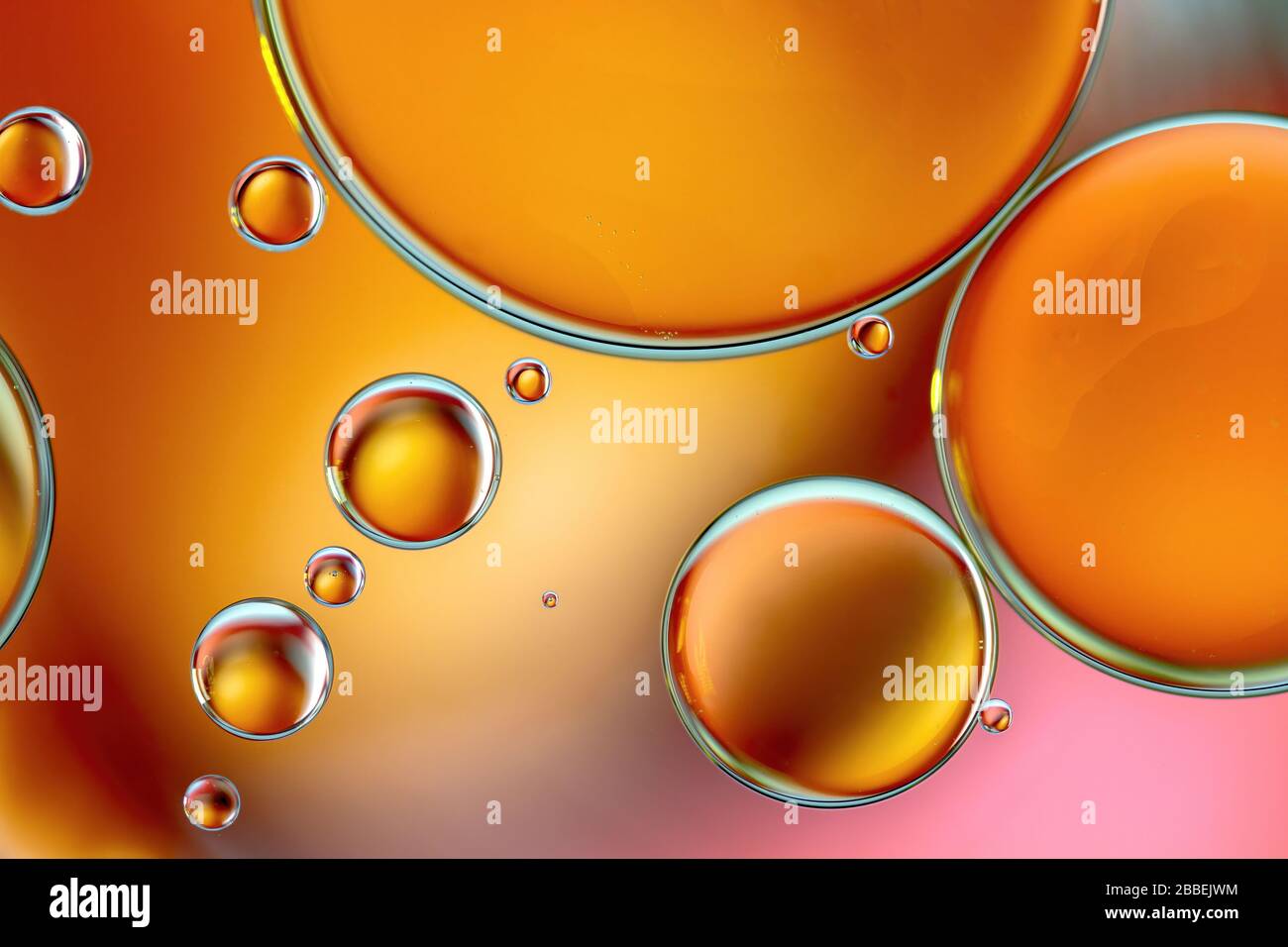 Colourful close up of oil drops floating on water Stock Photo