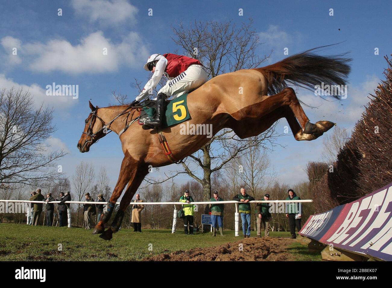 Minella Ranger ridden by Tom O'Brien in jumping action in the Andy Don Memorial Beginners Chase Stock Photo