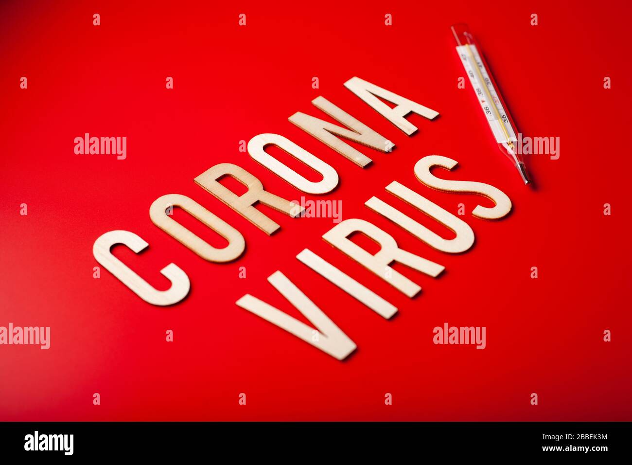 coronavirus word text wooden letter on red background corona virus covid-19 Stock Photo