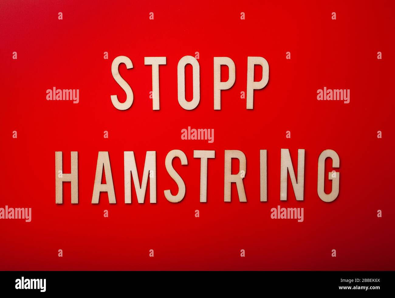 stopp hamstring norwegian word text wooden letter on red background coronavirus covid-19 Stock Photo