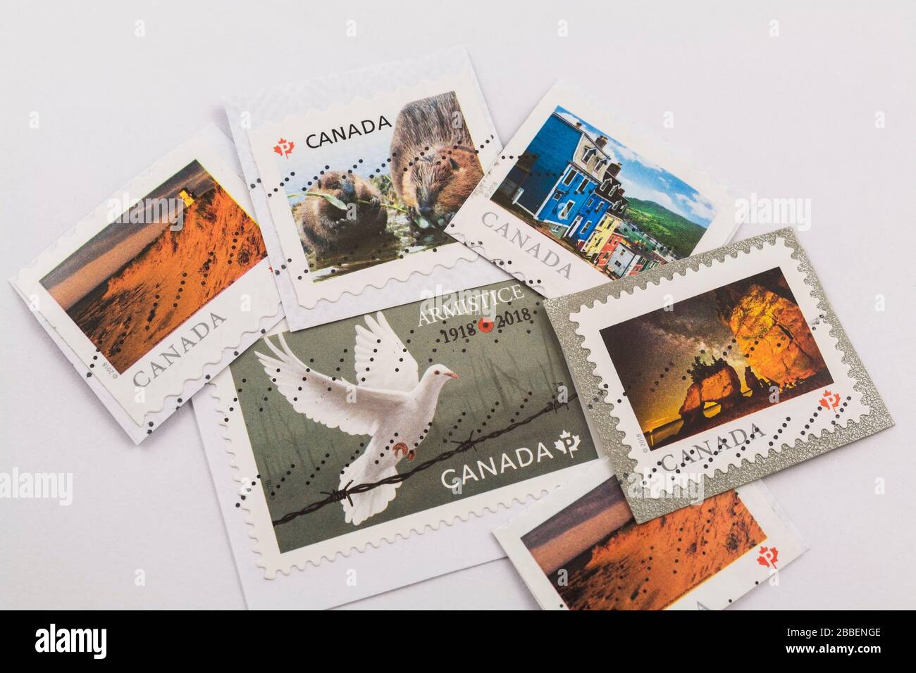 Various Canadian postage stamps on white background Studio composition, Quebec, Canada Stock Photo