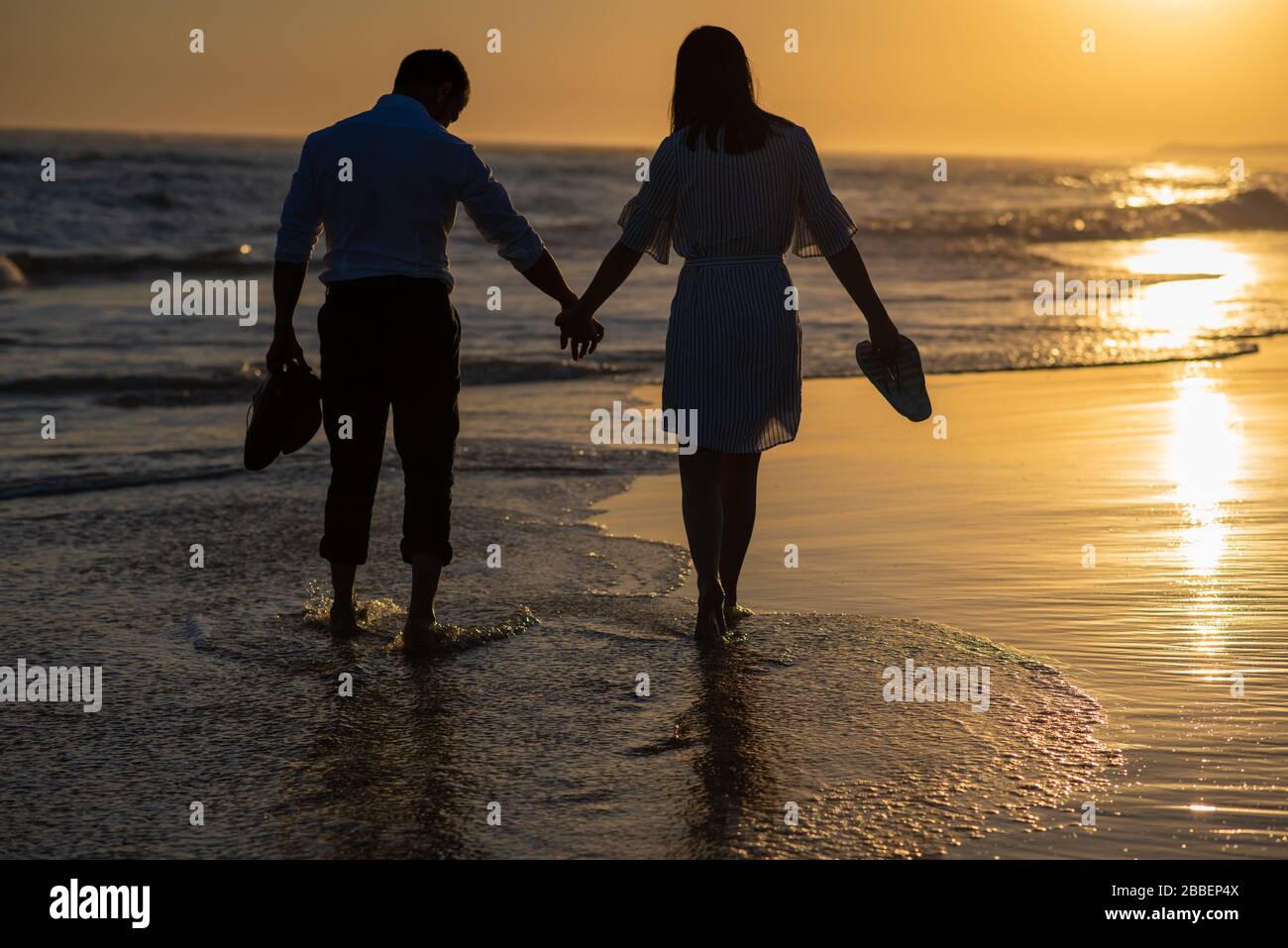 Silhouette couple walking hand hi-res stock photography and images - Alamy