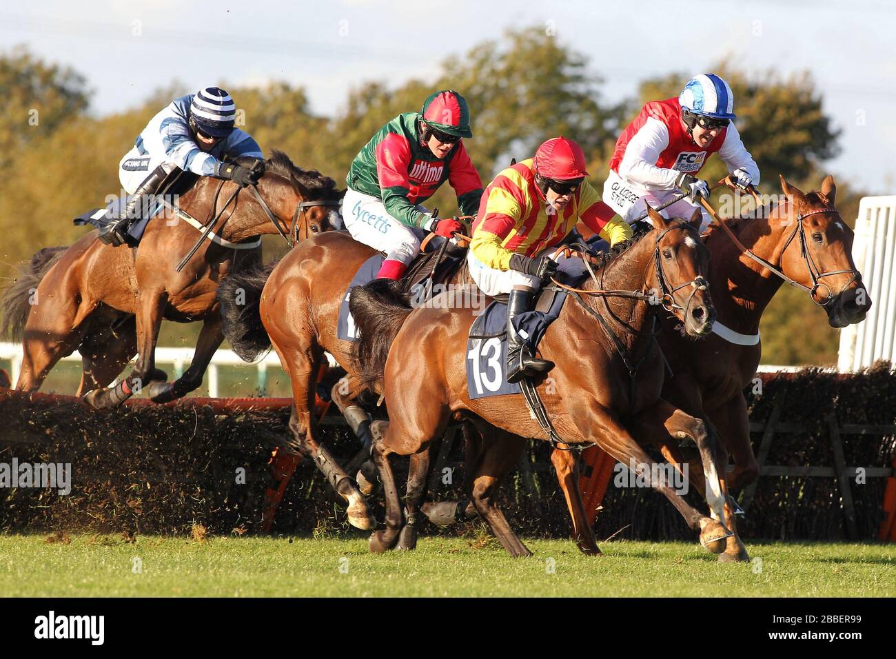 Race winner Genstone Trail ridden by Robert Thornton jumps behind Well Mett ridden by Timmy Murphy and Dancing Dude ridden by Andrew Tinkler (R) durin Stock Photo