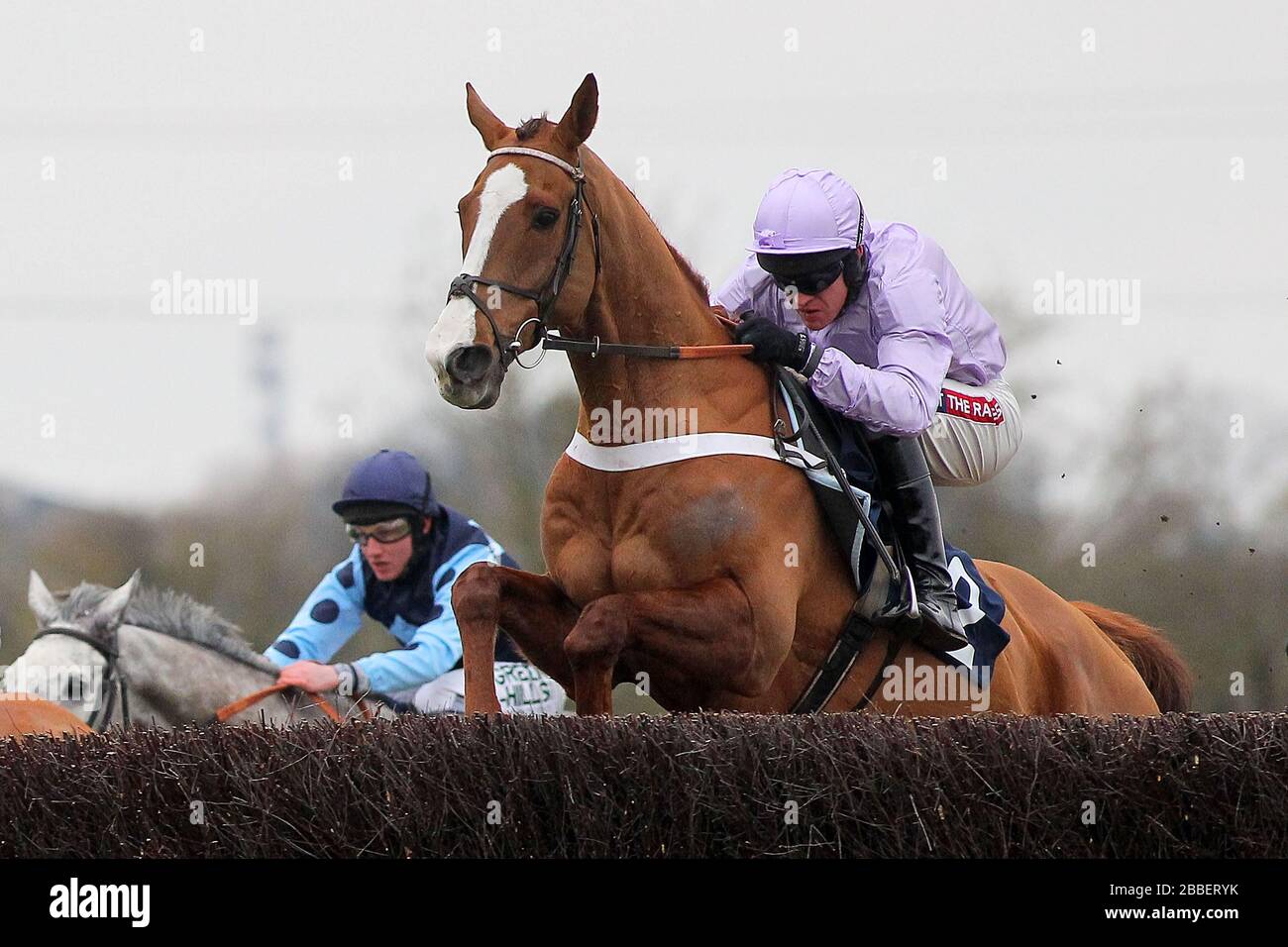 Race winner Tetlami ridden by Barry Geraghty in jumping action in the Huntingdon Racecourse Novices Chase Stock Photo