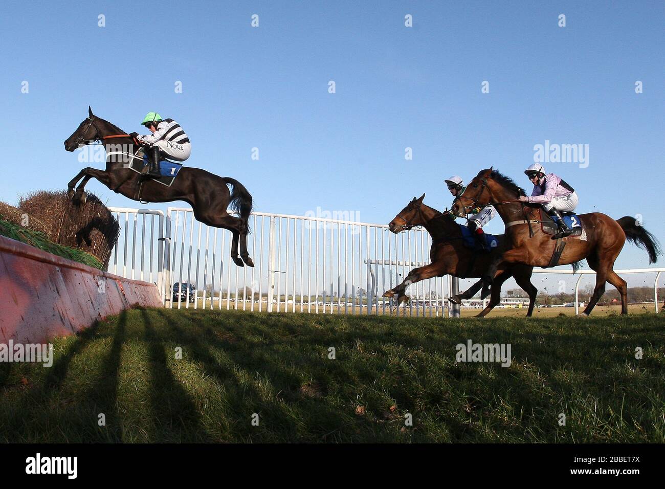 Race winner Owen Glendower ridden by Barry Geraghty in jumping action during the Weatherbys Cheltenham Festival Betting Guide Novices Chase . Stock Photo