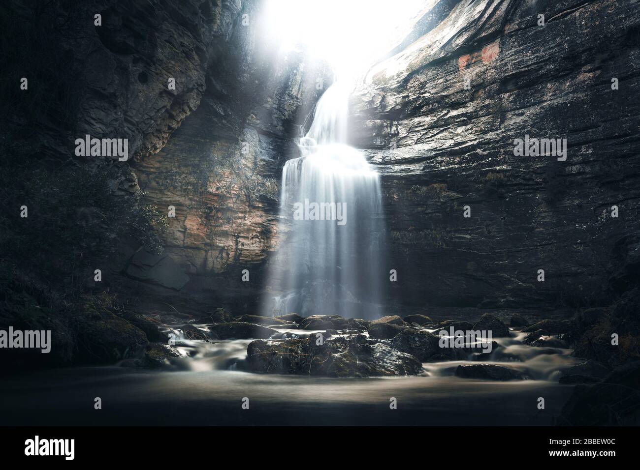 Waterfall in a cave in a mysterious environment Stock Photo Alamy