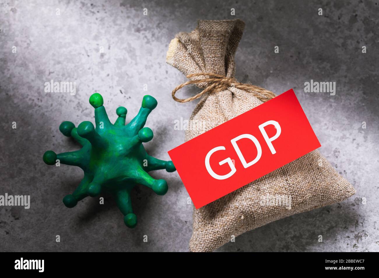 Coronavirus, tag with textiles and a full bag, top view. Concept on the impact of the covid-19 pandemic on GDP Stock Photo