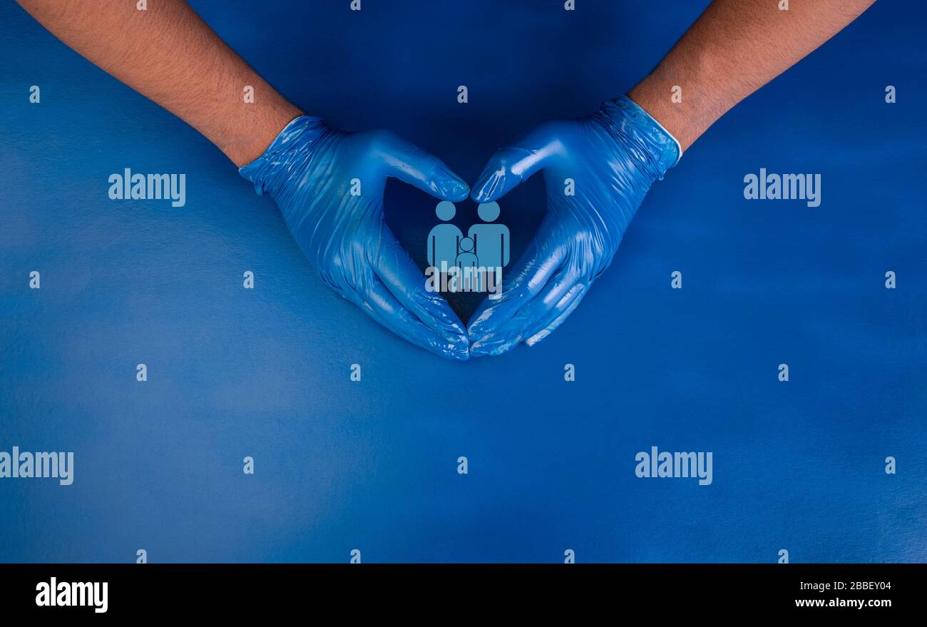Protect your family concept with doctor hands making heart shape Stock Photo