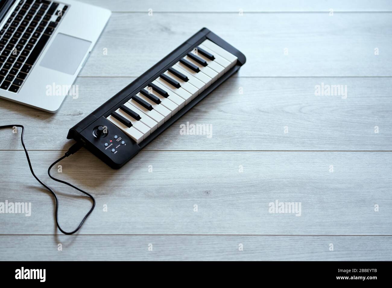 keyboard musical instrument on a white floor Stock Photo