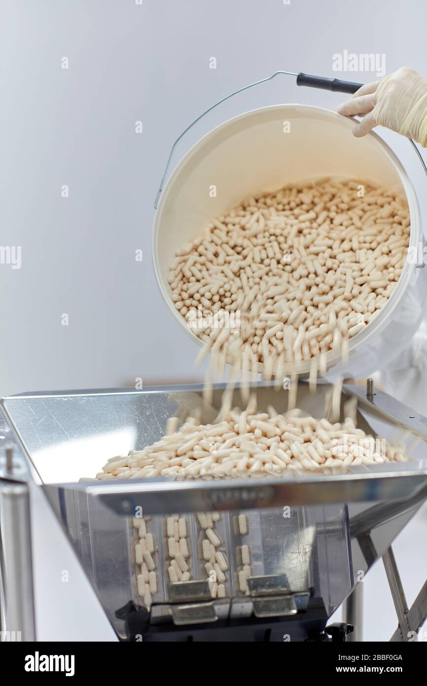pill making machine mass production, health care, nutrition, supplement, white, capsule, additive, steel, clean, hygienic, clean room, Stock Photo