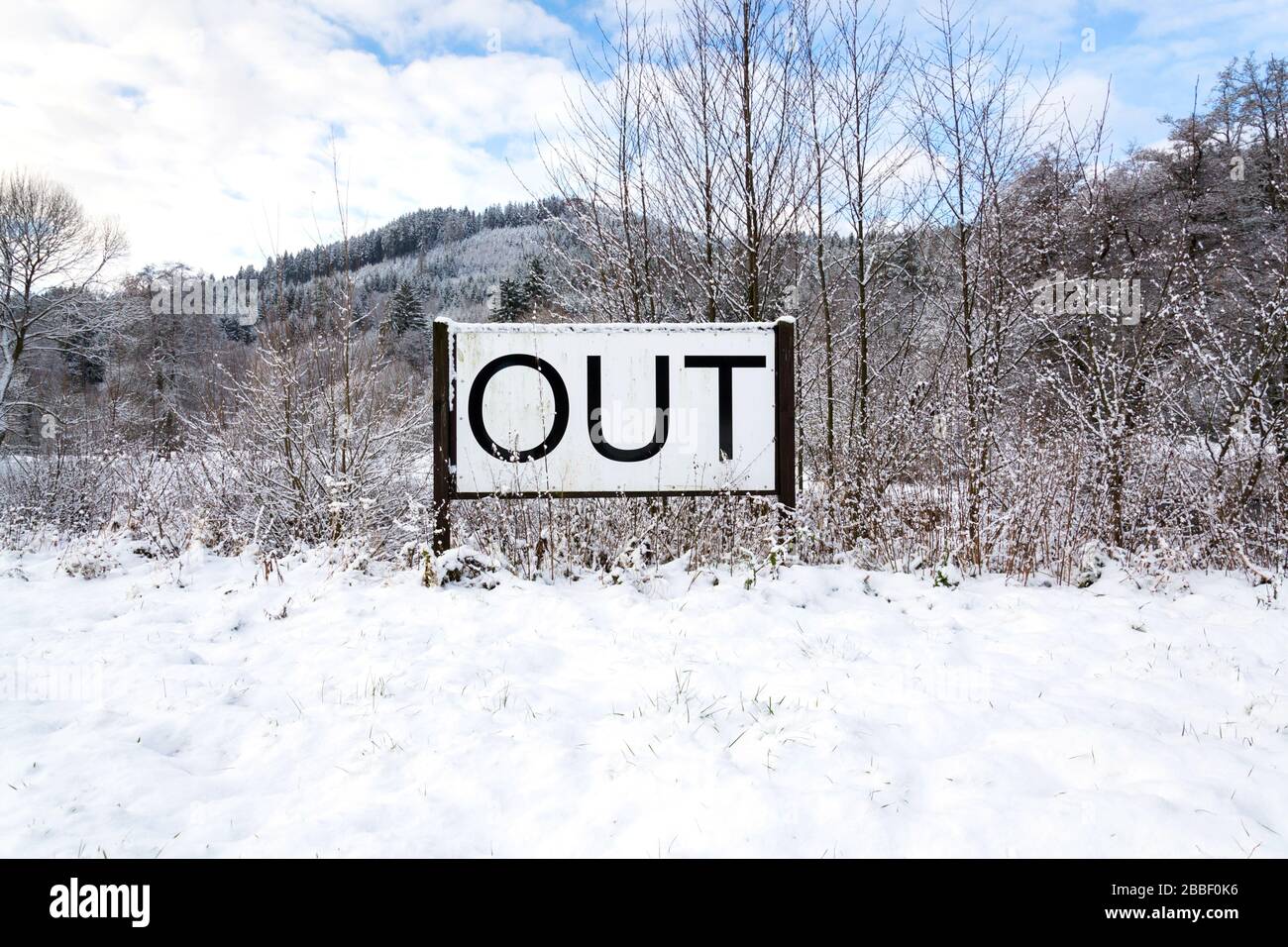 Out sign in snowy landscape, lonely walk in natuer, active lifestyle change concept, mind body soul improvement, winter day Stock Photo