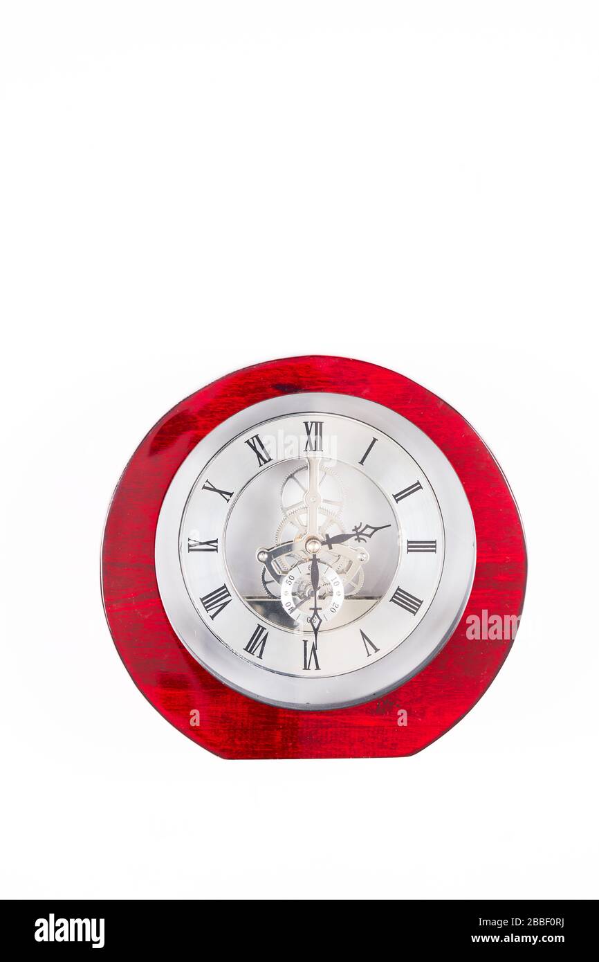 Mantelpiece or table top analogue clock with roman numerals showing a time of 2:30 pm. Stock Photo
