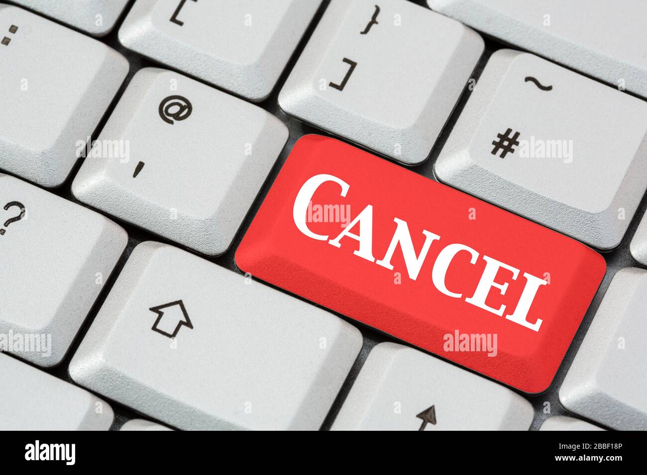 A keyboard with word Cancel in white lettering on a red enter key. Cancelling something concept England, UK, Britain Stock Photo